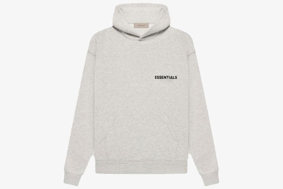 Essentials Core Collection Pullover Hoodie in light gray with a relaxed fit and a soft fleece interior.