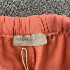 Fear Of God Essentials Pants Coral