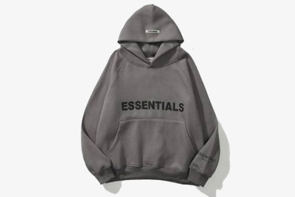 ESSENTIALS Oversized Hoodie in gray, featuring bold black text, spacious hood, and relaxed fit, perfect for casual wear.