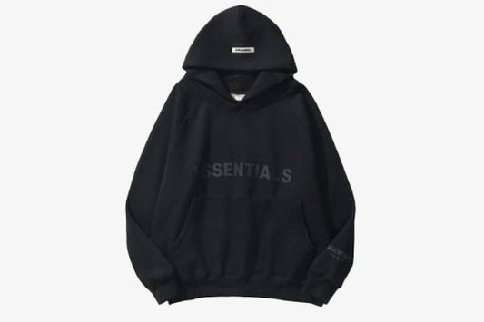 Black ESSENTIALS oversized hoodie with spacious hood and relaxed fit, ideal for casual and athleisure outfits.