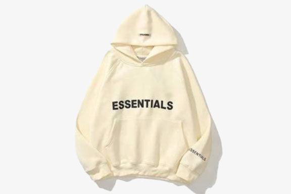 ESSENTIALS Oversized Hoodie in a neutral beige tone, featuring a spacious hood and relaxed fit for comfort and style.