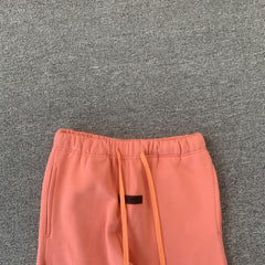 Fear Of God Essentials Pants Coral